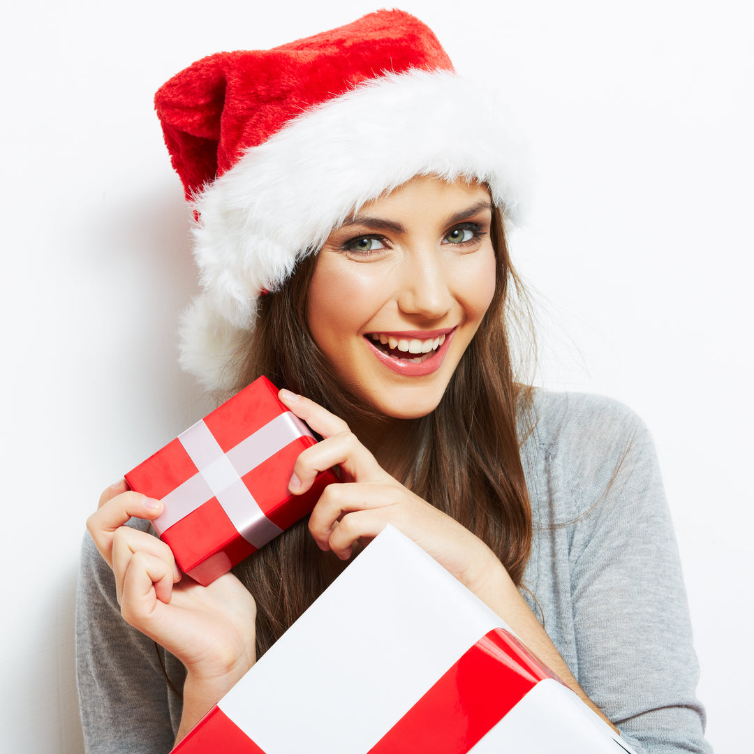top Christmas gifts for women - happy girl holding gifts