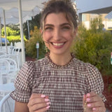 Woman showing how to apply and remove Chrysmela earring jackets.  So easy.  Yet so secure and lift your stud earrings, inplace of conventional earring backs.