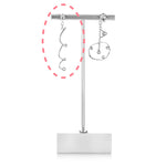 Platinum earring jackets on earring stand against white background